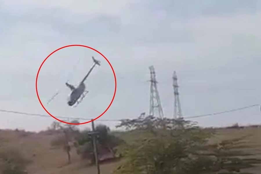 Helicopter entangled with electric wires