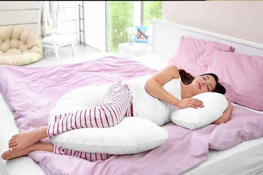 a pillow between your legs while sleeping
